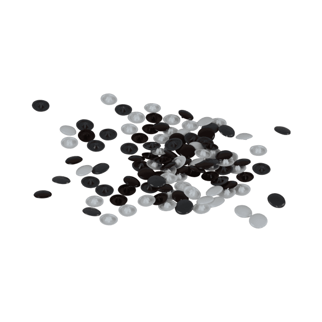 A pile of small round push-in screw caps in black and white, scattered on a white background.